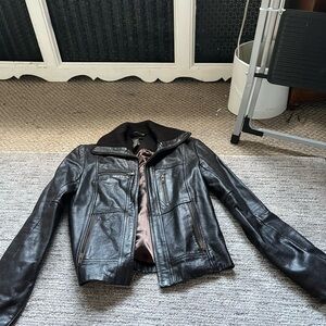 Leather jacket in awesome condition. Size 4, keeps you warm. It’s a brownish col